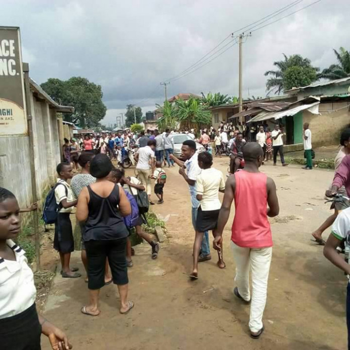 Parents rushing to Christ Kingdom International School, Oron, to withdraw their children on Wednesday. Credit: The NEXT EDITION fan BREAKING: Teachers, Pupils Flee Schools in A’Ibom over Fears of Forced Military Inoculation