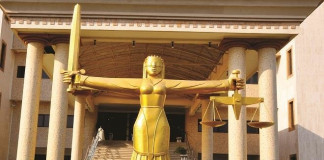 Two remanded in prison for stabbing woman to death