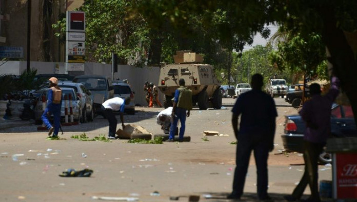 Ouagadougou-residents-watch-as-soldiers-take-position-near-the-French-embassy-as- Four terrorists killed in Ouagadougou