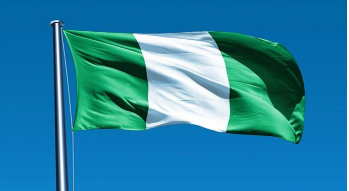 nigeria flag TNE American Multinational Coy. Hoists Nigerian Flag to Honour Employee