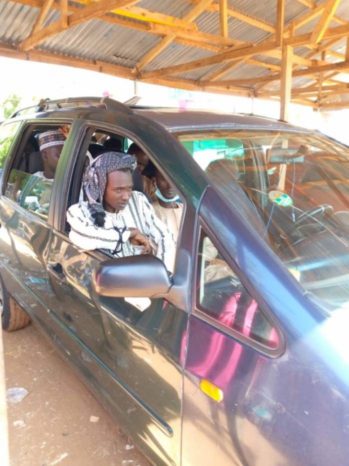 the-suspect-sitting-by-the-door-on-the-front-seat-